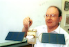 Prof. Yuval Neeman pointing of the Israeli Communication satelite 'Amos' which will by launched in the near future – הספרייה הלאומית
