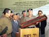Poland's Chief of Staff Tadeusz Wilecki, (R) at Israel's Museum and Memorial to the Holocaust in Jerusalem, Yad Vashem holds a rifle which was used by members of the Warsaw Ghetto Uprising and found in Gensha Street in 1943 after the resistance was crushed which he presented to the museum.