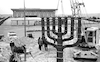 A huge bronze candelabre, Menora, was placed opposite the new Knesset building – הספרייה הלאומית