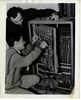 A youngster getting taught to repair telephone switchboards in the JDC-subsidized ORT school in Casablanca.