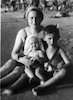 A picture of a women and two kids on the beach – הספרייה הלאומית
