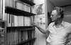Efraim Kishon famous writer at home with his books which he wrote – הספרייה הלאומית
