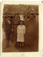 Group photo: two women, one man, one male teenager, one girl.