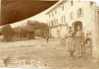Madonna della Salute, two women and an infant holding hands in front of a building with Christian wall painting, 16 Nov 1917.