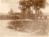 In front of the "Sanitäts-Barracke" (hospital barracks), soldiers in a big van and one sitting in front.