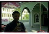 Photograph of: Boris Khaimovich in front of the Small Synagogue in Pazardzhik.