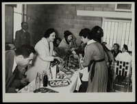 Mrs Sher receiving a bouquet from the mothers of the sick children at the reception. On the left Mr. Ephraim Dowek, the mayor of Bet She'an.