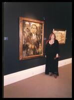 Photos of Ricci Horenstein, in front of Leo Kestenberg's portrait.