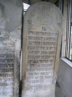 Photograph of: Ohel in the Jewish cemetery in Zabolotiv : TOmbstone of Frida Kila, daughter of R. Yeshayahu Shor from Iassi, second wife of R. Yaakov Hager in the ohel.