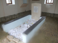 Photograph of: Ohel of Rabbi Aharon II of Karlin in the Jewish Cemetery in Mlyniv : TOmbstone of R. Aharon II of Karlin.