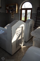 Photograph of: Ohel of the Besht in the Old Jewish Cemetery in Medzhybizh : Tombstones of R. Zeev Volf Kitzes and R. Menahem Monish Dayan.