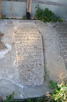 Photograph of: Women's ohel in the New Jewish Cemetery in Medzhybizh : Tombstone of Reyzil, daughter of R. Israel Shalom Yosef in the ohel.