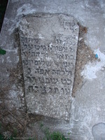 Photograph of: Women's ohel in the New Jewish Cemetery in Medzhybizh : Tombstone of Tziporah Gitel, daughter of R. Israel Shalom Yosef in the Ohel.