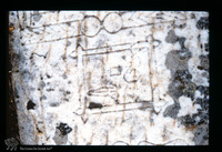 Photograph of: Tomb of Hanna daughter of Rabbi Yehosha son of Rabbi Aaron, Jewish Cemetery in Karnobat : Tomb of Hanna Daughter of Rabbi Yehosha Son of Rabbi Aaron: Embroidery Frame and Sewing Tools; Ottoman Metal Buckle (Bulgarian: pafti).