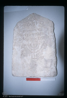 Photograph of: Ancient tombstone with Hebrew inscription and incarved menora in the Archeological Museum in Durrës : General view.