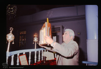 Photograph of: Torah reading in the Kal Yavanim (Greca) Synagogue in Trikkala, Greece : Elevating the Torah.