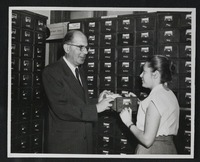 Dr. Curt Wormann, Director of the Jewish National and University Library, instructing a student of the Graduate Library in cataloguing techniques.