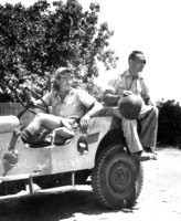 Moshe Dayan arriving by a military jeep.