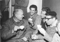 Defence Minister Moshe Dayan drink a cup of coffee with some members of Kibbutz Gesher during his visit after the frontiere clash on January 17, 1968.