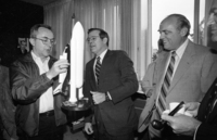 Ronald Rumsfeld presenting a small model of the Shuttle Missile to Moshe Arens, Defence Minister while US Ambassador Samuel Lewis looks on.