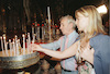 Famous Singer Charles Aznavour lightning candles at the Holy sepulchre Church In Jerusalem.