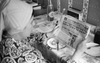 Photographer - David Weisfish's wife reading Yediot Achronot.