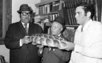 A religious ceremony for the birth of the son of blind invalid holding by the family whit the presence of guests and Rabbi Shmuel HaCohen Avidor.