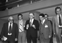 PM Menahem Begin descending steps th his advisors: left- Yehiel Kadishai.