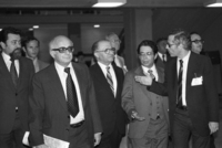 PM Menahem Begin descending steps with his advisors: left- Yehiel Kadishai.
