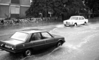 Cars splash through Tiberia's flooded roads during the recent rain storms.