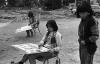 Pupils at a Givatayim high school take advantage of this week's pleasant weather to move a painting class outdoors.