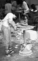 Pupils at a Givatayim high school take advantage of this week's pleasant weather to move a sculpture class outdoors.