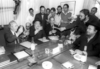 Shimon Peres, of the Labour Party met with Moshe Feldman and other representatives of the Agudat Israel religious party to sign a coalition contract for the next government.