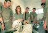 Girl soldiers teaching male soldiers the military warfare.