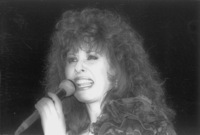 Yardena Arasi performing in a gathering party for wives of the Bezek Company workers.