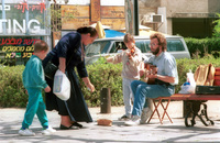 Poverty of the new immigrants from the Soviet Union pushed a father and his child to perform on the streets for passers by asking for their generosity and donation.
