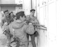 Soldiers trying to scatter the intifada rioters brakin into a shop where rioters were hidden – הספרייה הלאומית