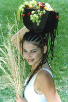 That fruit basket will not slide off her head.