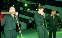 The Trio Adler, playing the mouth harmonica.