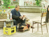 A tourist attraction when the Turkish shoe shiner perform his job.
