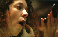 Keren Noibach putting on make up shortly before her newsreel transmission.