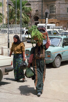 Arab women in their tradional costumes walking in the old city of Jerusalem.