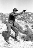 Samal Rishon Ein Dor performing gun shooting.