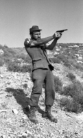 Samal Rishon Ein Dor performing gun shooting.