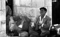 Beggars at the entrance to the Kiryat Shaul Cemetary.