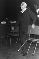 KM Mordechai Bentov taking a chair.