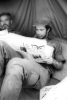 IDF soldiers reading an Israeli newspaper.