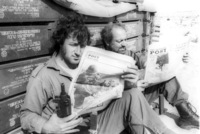IDF soldiers reading an Israeli newspaper.