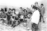 Reserve soldiers receiving a hair cut.