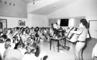 New immigrants participating on a free day leaarning the Hebrew songs.